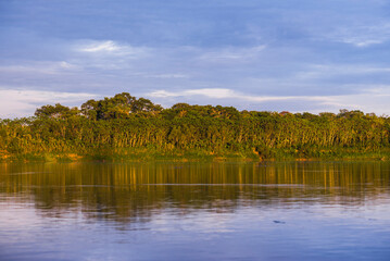 Sunrise over river in Amazon Jungle of Peru, Tambopata National Reserve, Peru, South America