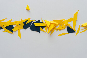abstract background with cut paper in yellow and blue