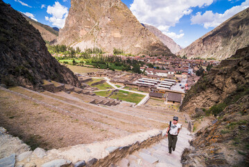 Tourist sightseeing at Inca Ruins of Ollantaytambo, Sacred Valley of the Incas (Urubamba Valley), near Cusco, Peru, South America