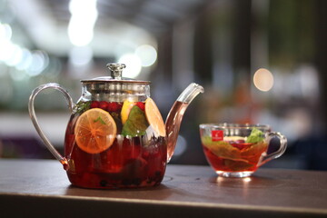 Fruit berry tea in a glass teapot