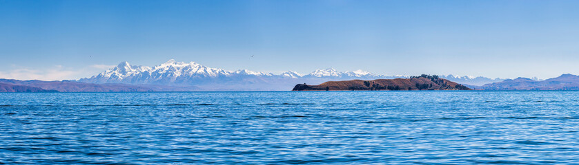 Fototapeta na wymiar Cordillera Real Mountain Range (part of Andes Mountains) behind Lake Titicaca, seen from Isla del Sol, Bolivia, South America
