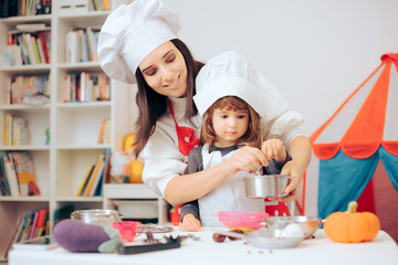 Mother and Daughter Playing together in Toy Kitchen 