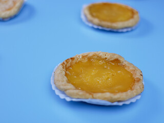 Pineapple flavored pie on blue background