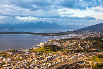 Fototapeta premium Sunrise view of Andes Mountains and Ushuaia cityscape, the southern most city in the world, Tierra del Fuego, Patagonia, Argentina, South America
