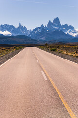 Long straight road to El Chalten, with Mount Fitz Roy (aka Cerro Chalten) behind, El Chalten, Patagonia, Argentina, background with copy space, South America, background with copy space