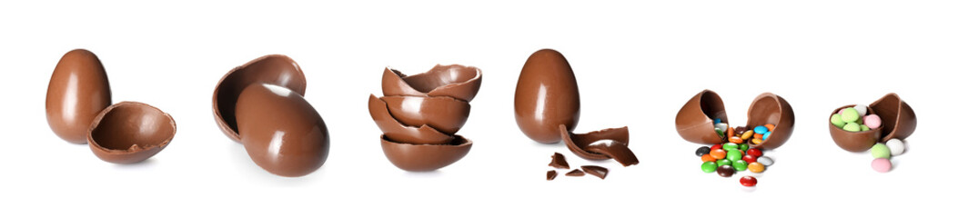 Chocolate Easter eggs with candies on white background