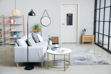 Interior of modern room with stylish sofa