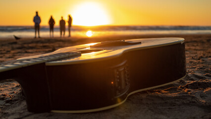 Sunrise on the beach with guitar and friends. In Argentina.