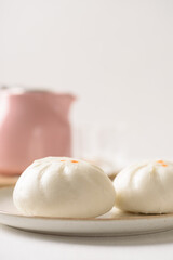 Steamed Chinese bun on white background, a popular Asian street food