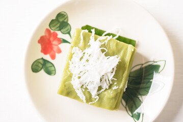 Pandanus pudding with coconut topping on white background, Traditional sweets that are cultural heritage of Asia.