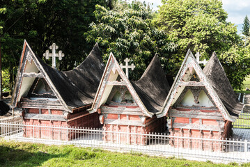 Fototapeta na wymiar Traditional Batak style graves at Lake Toba (Danau Toba), West Sumatra, Indonesia, Asia