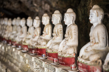 Fototapeta premium Buddha statues at Kaw Ka Thawng Caves, Hpa An, Kayin State (Karen State), Myanmar (Burma)