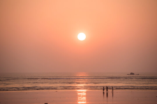 People on Maungmagan Beach at sunset, Dawei, Tanintharyi Region, Myanmar (Burma)