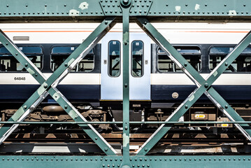 Tube crossing Hugerford and Golden Jubilee Bridge, London, England, United Kingdom