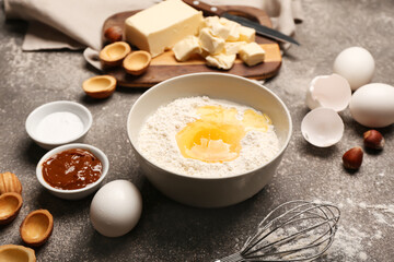 Fresh ingredients for preparing walnut shaped cookies with boiled condensed milk on grey background