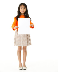 Portrait full body cutout isolated studio shot of Asian young happy primary schoolgirl model in casual outfit standing holding advertising placard paper board for text copy space on white background