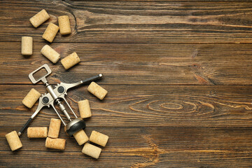Wine corks and opener on wooden background