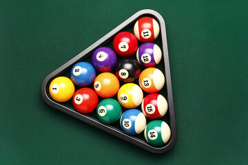Rack with billiard balls on green table - obrazy, fototapety, plakaty