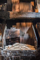Pounding wool using a water driven mill wheel, Sarbi, Maramures, Romania