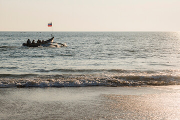 Tourist boat trip at Palolem Beach at sunset, Goa, India