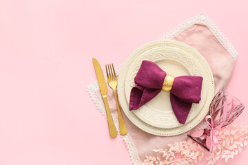 Stylish table setting with flowers on pink background