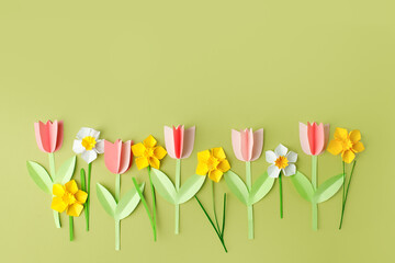 Happy easter spring concet - papercraft seasonal flowers on blue background for kids holiday party...