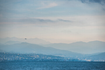Flight arriving into Nice airport, seen from Antibes, Provence-Alpes-Côte d'Azur, South of France,...