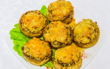 Delicious and healthy national food. Baked pies with dough lie on a white plate.