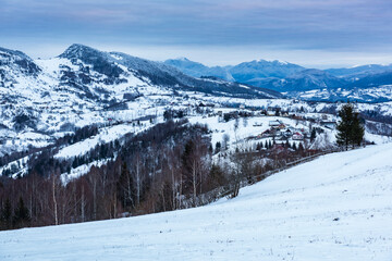 Fototapeta na wymiar Carpathian Mountains snowy winter landscape, Pestera, Bran, Transylvania, Romania