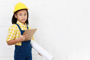 Portrait studio shot Asian young little elementary schoolgirl future dream job career as engineer...