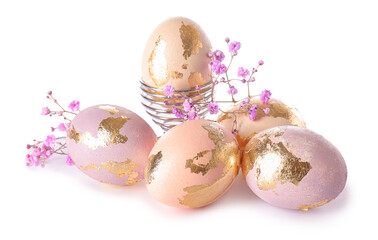 Beautiful Easter eggs and gypsophila flowers on white background