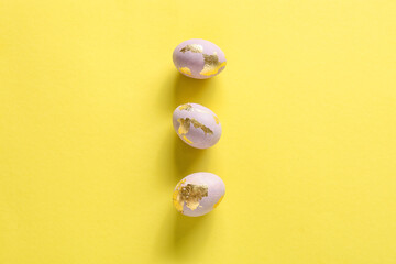 Beautiful Easter eggs on yellow background