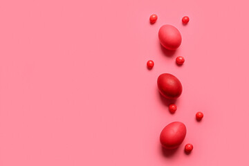 Red painted Easter eggs on color background