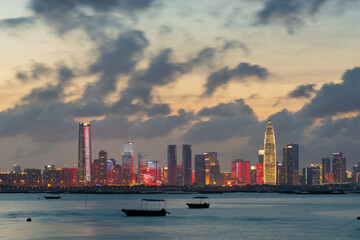 Naklejka premium Skyline of Shenzhen city, China under sunset. Viewed from Hong Kong border Lau Fau Shan
