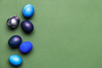Beautiful Easter eggs on green background