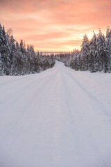 Fototapeta na wymiar Bad driving conditions on dangerous icy roads in slippery, ice and snow covered cold weather winter scenery in Lapland, Finland, Europe