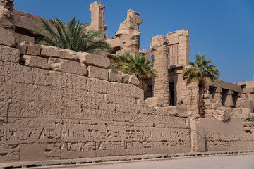 View of the wall with Egyptian hieroglyphs and ancient drawings at Karnak Temple. Luxor, Egypt.