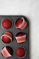 Red velvet muffins on a white background. Homemade cupcakes. Valentine day present.
