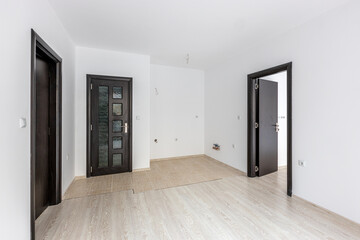 Empty bright living room. New home. Beautiful apartment interior. Wooden floor