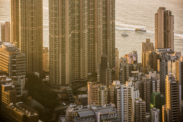 Fototapeta premium Boats in Victoria Harbour at sunset, seen from Victoria Peak, Hong Kong Island, Hong Kong, China