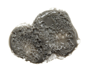Bublbe clay mask texture. Cosmetic carbonated face cleansing mud cream smear isolated on white background. Gray natural mineral skincare product smudge