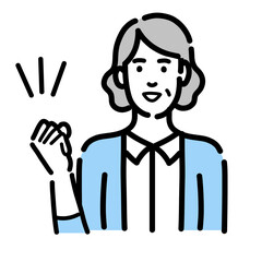 笑顔でガッツポーズをしているシニアの女性
