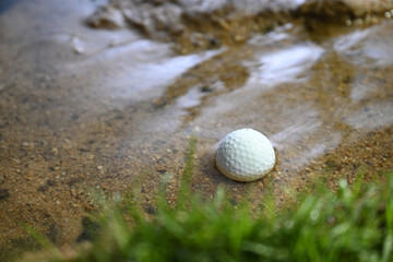 golf ball in water hazard