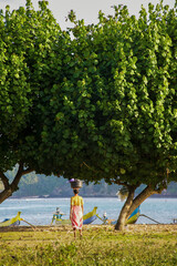 Woman Selling Ikat Weavings on the Beach at Kuta Lombok, South Lombok, Indonesia, Asia