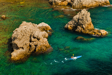 Sea Kayaking in Dubrovnik, a tourist kayaking in the Mediterranean Sea, Croatia