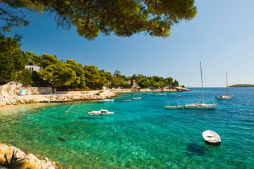 Fototapeta na wymiar Photo of boats on the crystal clear Adriatic Sea, Hvar Island, Adriatic Coast, Dalmatia (Dalmacija), Croatia