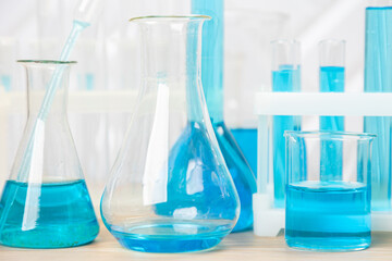 Laboratory glassware with test tubes. flasks, dropper, petri dishes, measuring cups and cylinders for scientific laboratories,