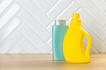 Cleaning product plastic container for house clean on wooden table . household chemicals