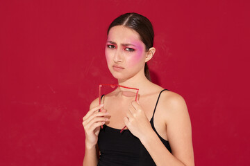 Naklejka premium pretty woman pink face makeup posing attractive look isolated background unaltered