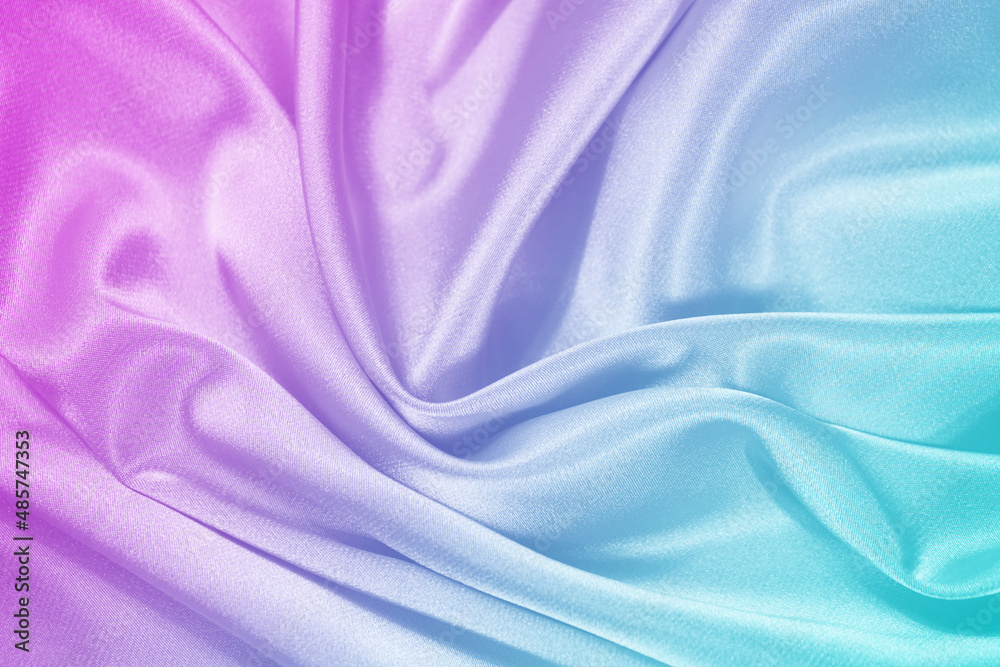 Wall mural pink tuquoise silk satin. gradient. wavy folds. shiny fabric surface. beautiful purple teal backgrou